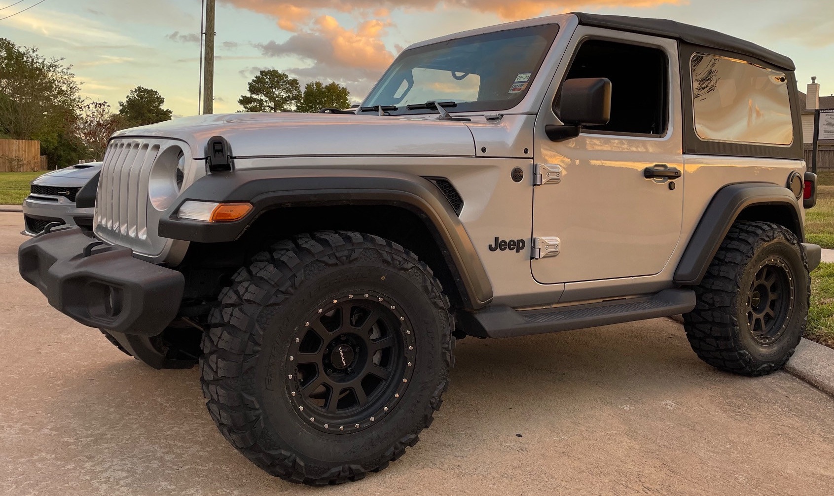 profile view of jeep wrangler in parking lot