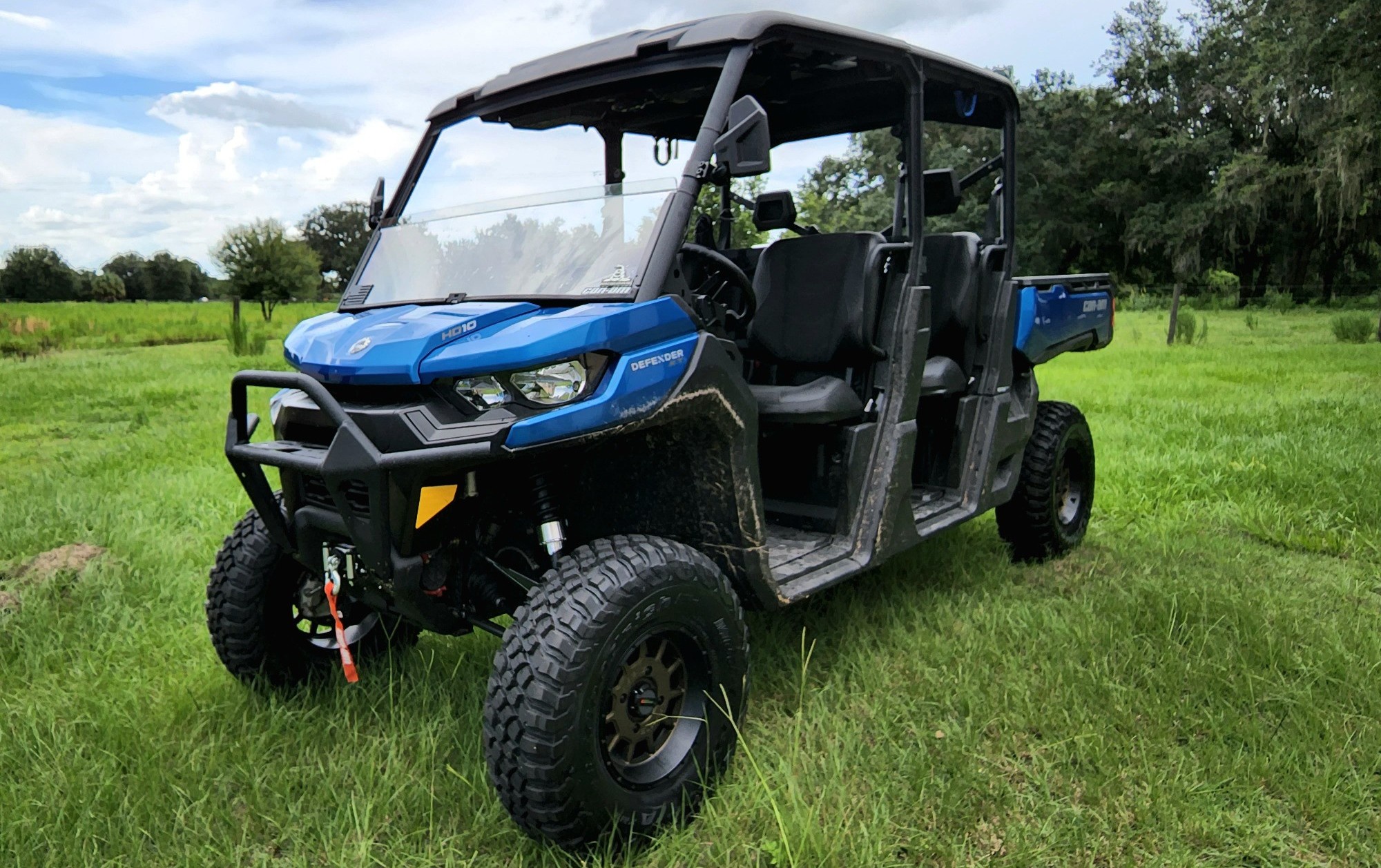 front view of polaris utv on grassy field