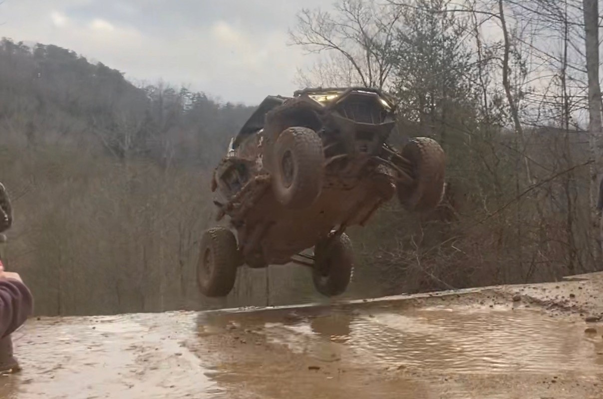 utv jumping over hill
