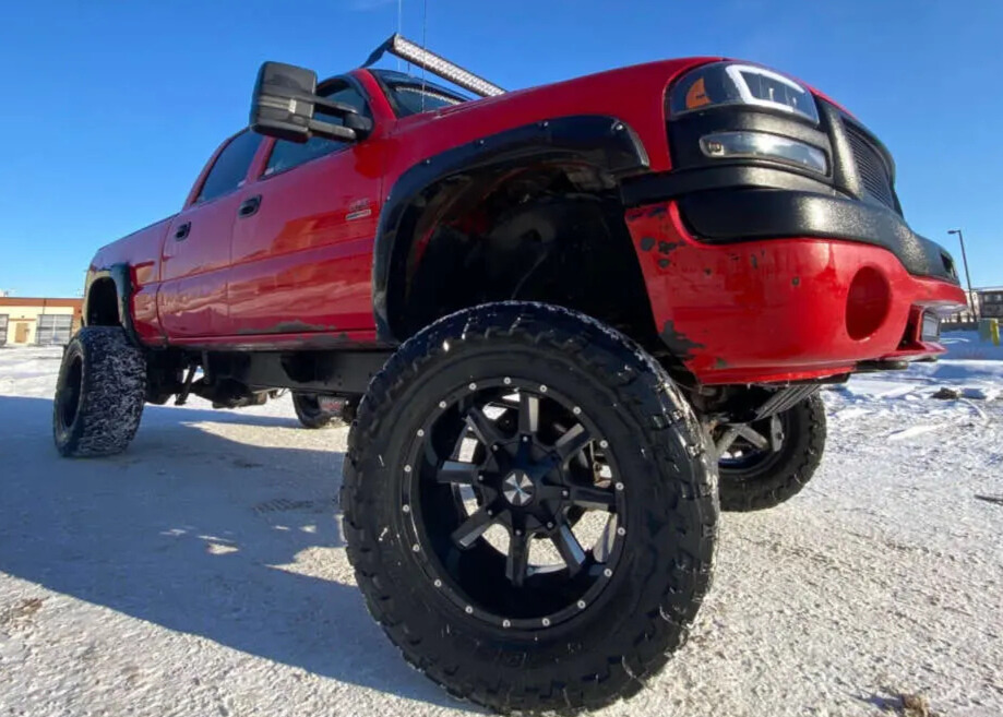2005 GMC Sierra 2500 HD with Cali Offroad Distorted wheels and Toyo Open Country M/T tires