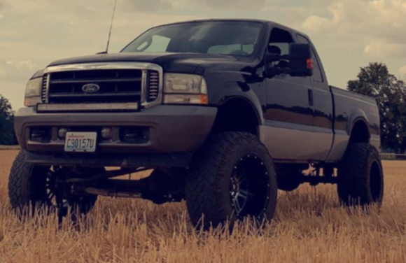 2003 Ford F-250 Super Duty with American Offroad A106 wheels and Nitto Trail Grappler tires