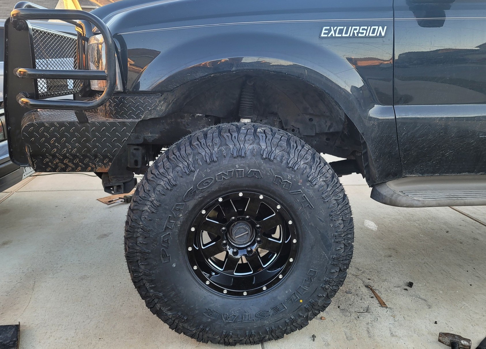 isolated view of ford excursion wheel