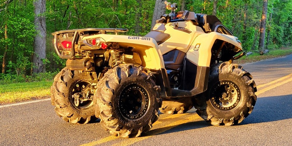 can am atv parked on road