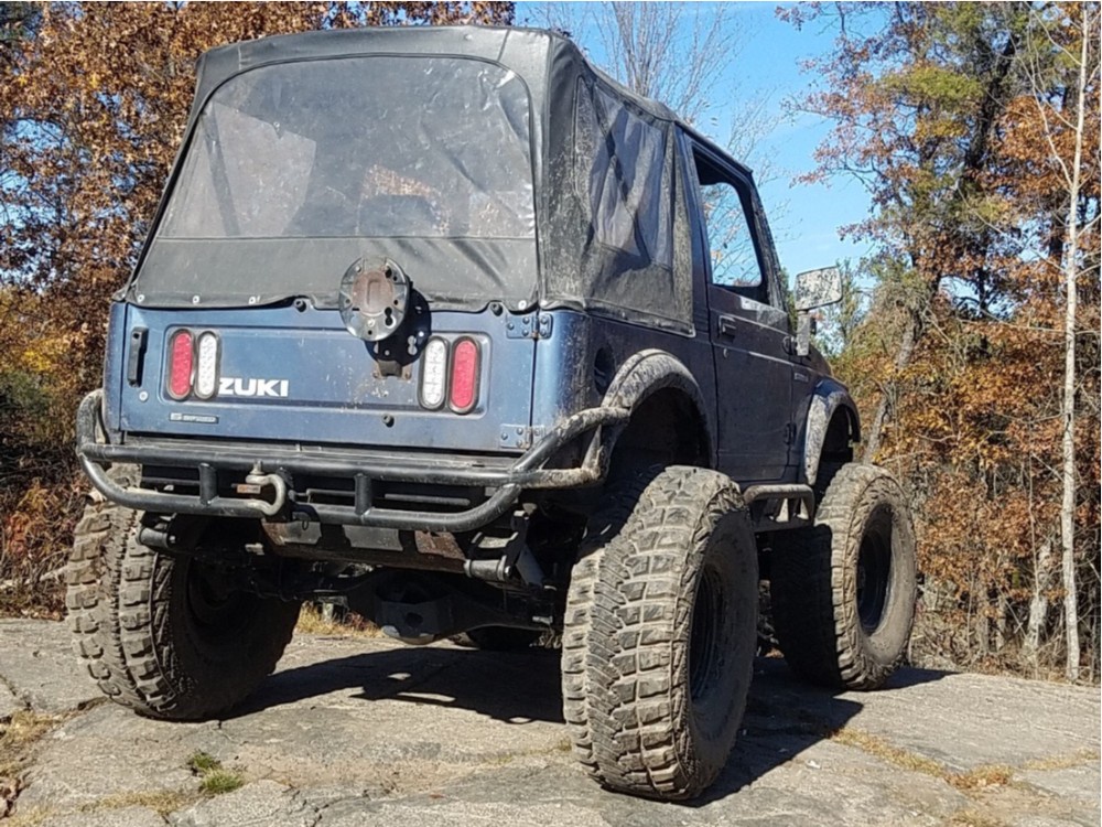Rear shot of blue Suzuki Samurai