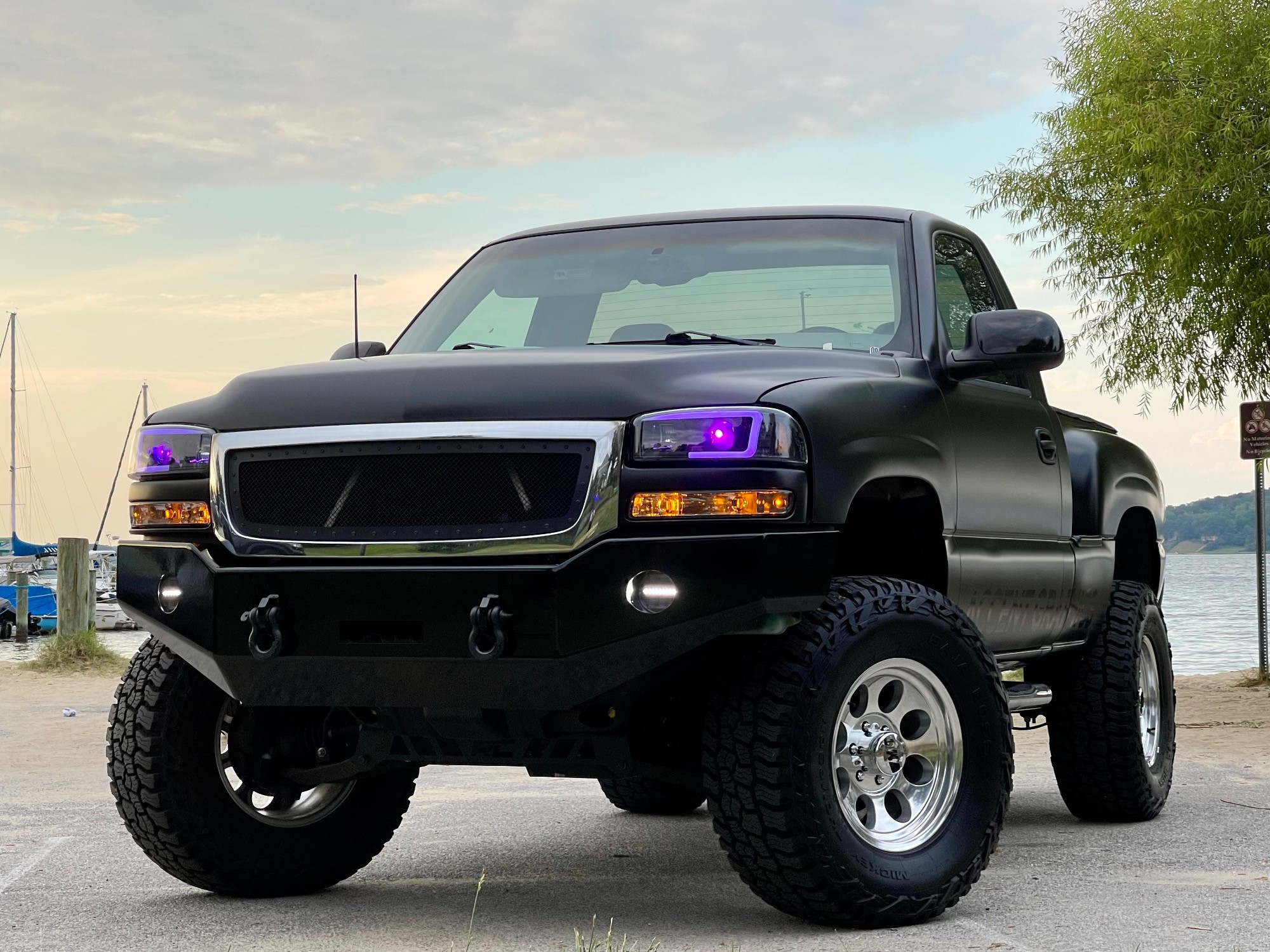 2003 GMC Sierra 1500 SLE with Mickey Thompson Baja Boss A/T tires and Rough Country Suspension Lift