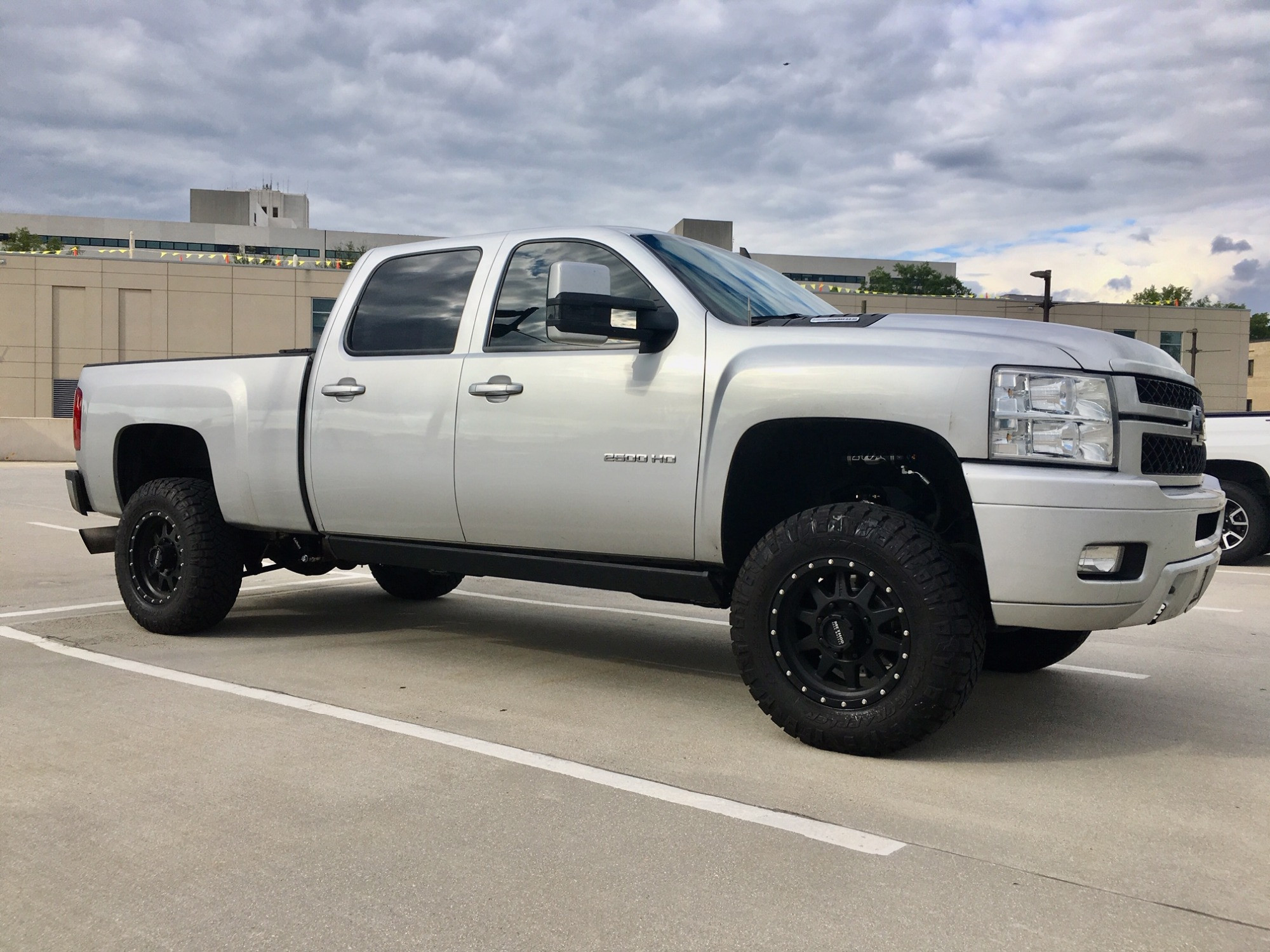2014 Chevy Silverado 2500 HD with Nitto Ridge Grappler tires and Method Standard wheels