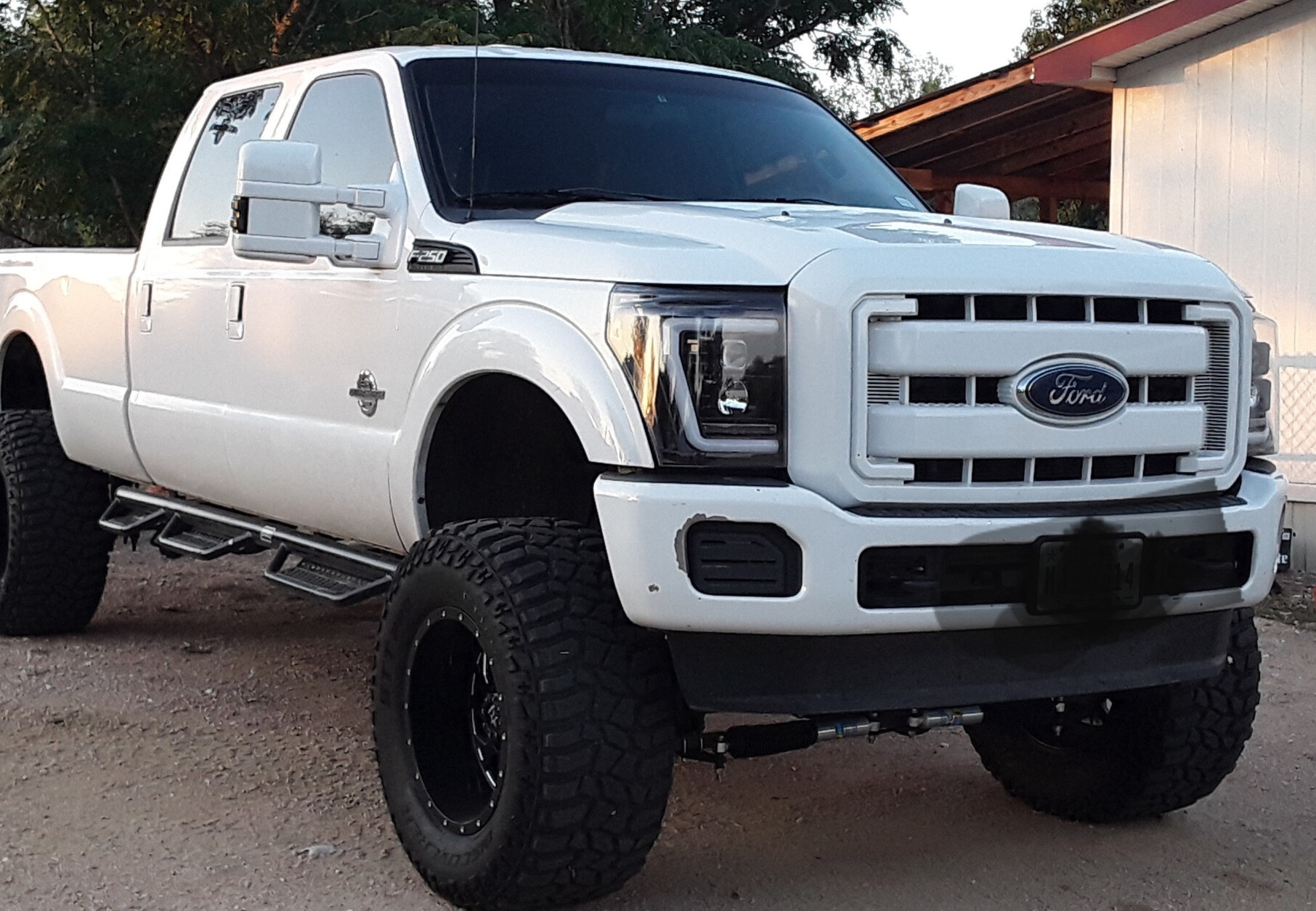 2015 Ford F-250 with Cooper Discoverer STT Pro tires and Superlift Suspension Lift