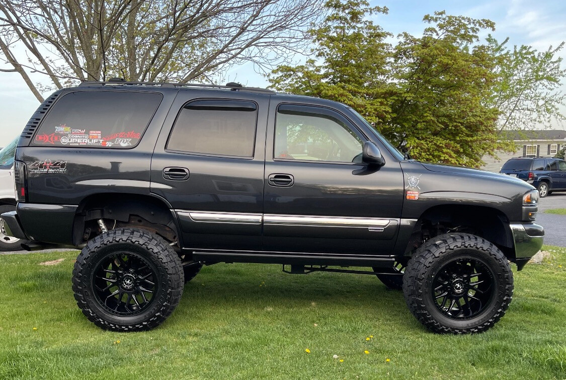 2006 GMC Yukon with Toyo Open Country M/T tires and Superlift Suspension Lift