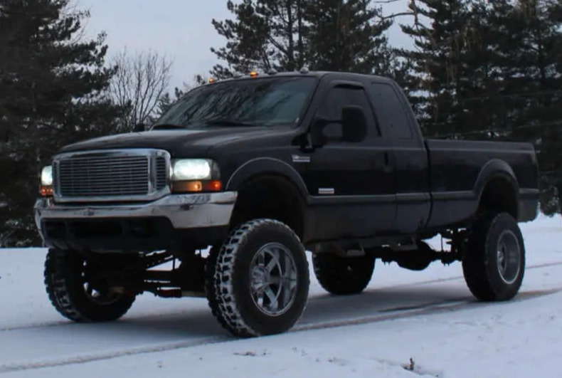 1999 Ford F-350 Super Duty with BDS Suspension Lift and Moto Metal MO962 wheels