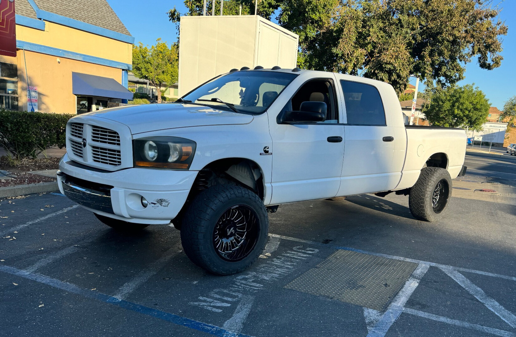 2006 Dodge Ram 3500 Laramie with Arkon Off-Road Alexander wheels and Nitto Ridge Grappler tires