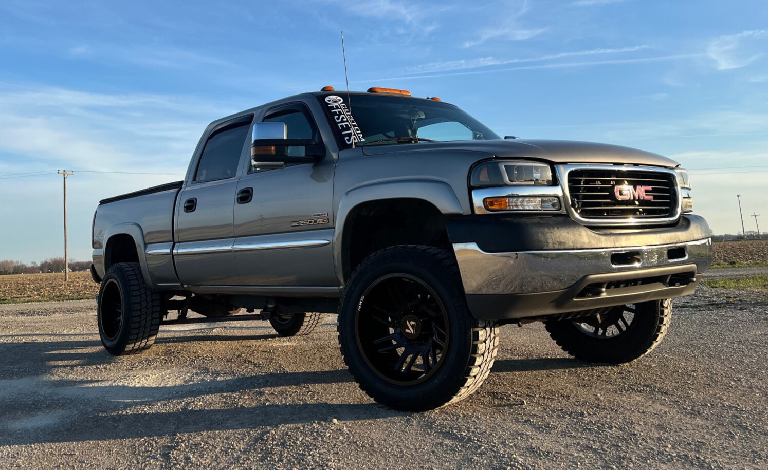 2002 GMC Sierra 2500 HD SLT with Gladiator QR00-MT tires and Torch Offroad Suspension Lift