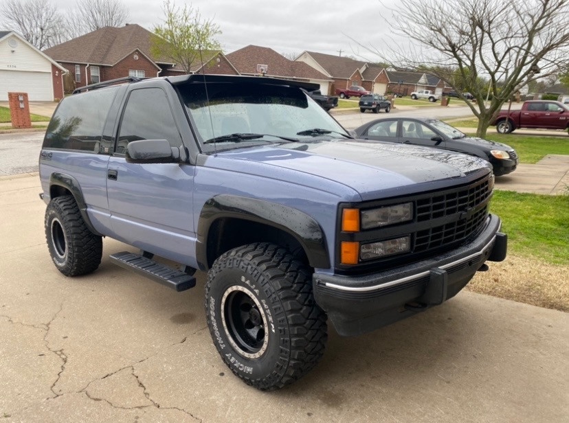 front view of black and blue chevy blazer
