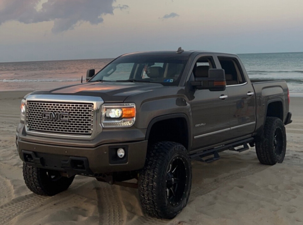 2015 GMC Sierra 1500 Denali with Mickey Thompson Baja Boss A/T tires and Rough Country Suspension Lift