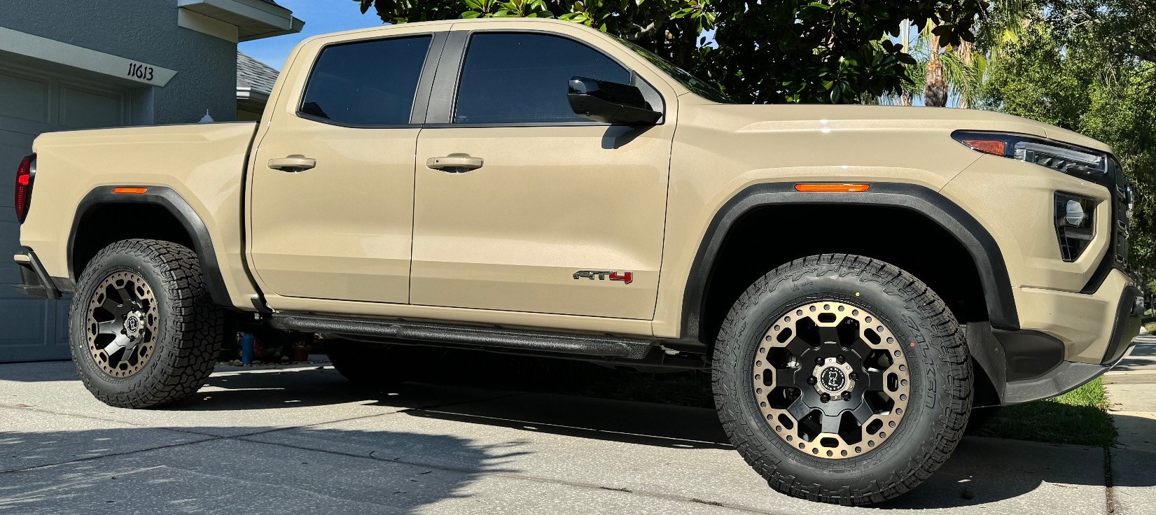 tan gmc canyon in driveway