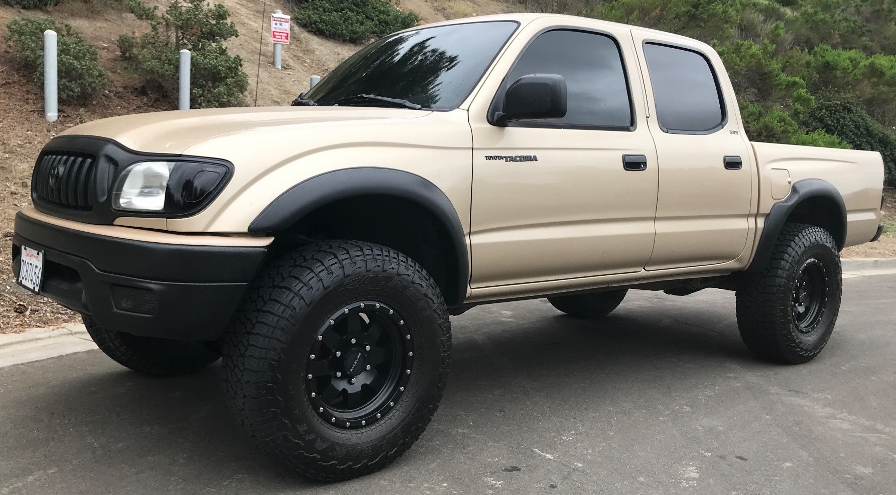 profile view of tan toyota tacoma