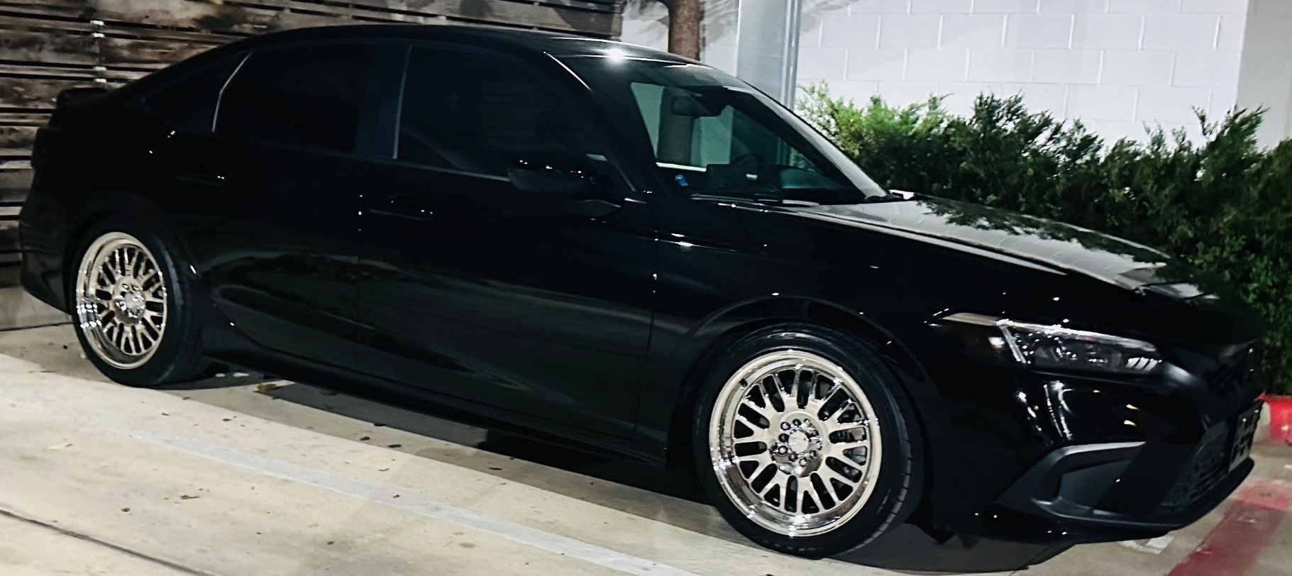 black sedan in parking lot