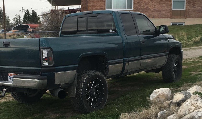 rear shot of green ram 2500 custom offsets