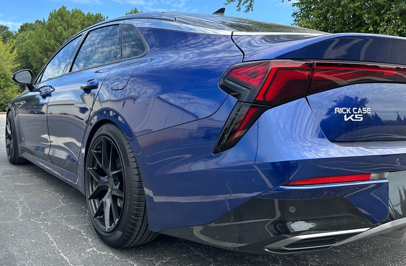 rear shot of blue car with pirelli tires fitment industries