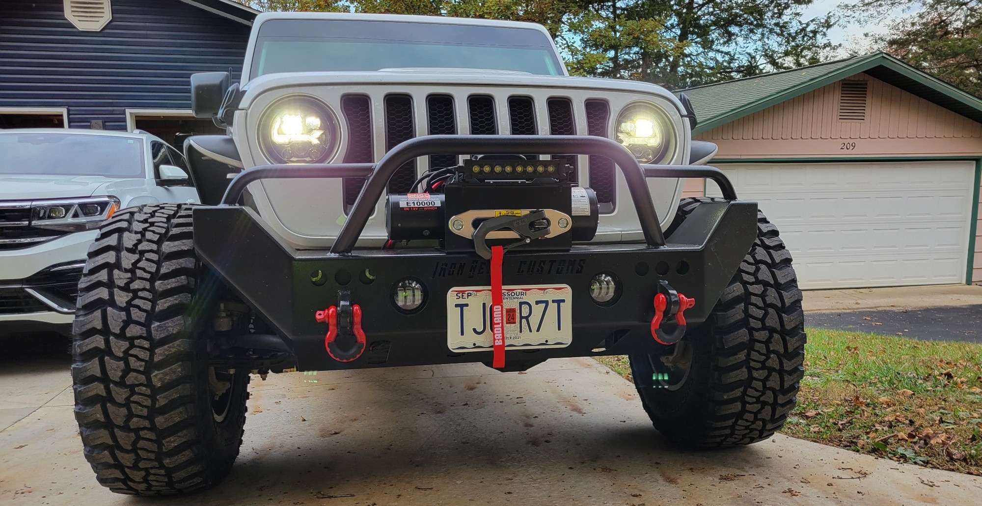 front view of jeep wrangler with winch and aftermarket suspension