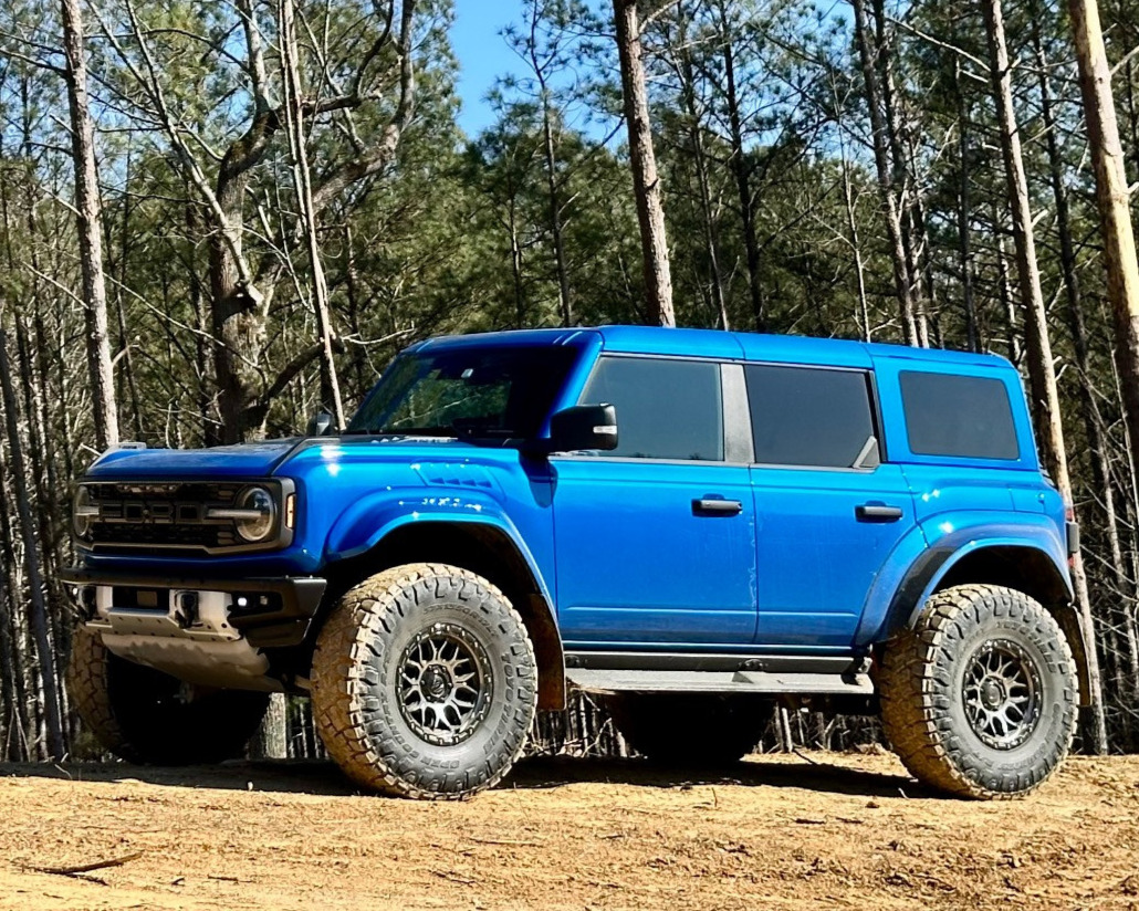 blue ford bronco with off-road tires