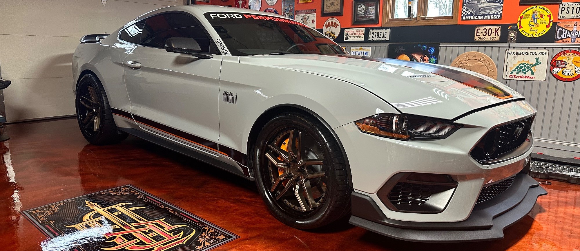 white ford mustang in garage