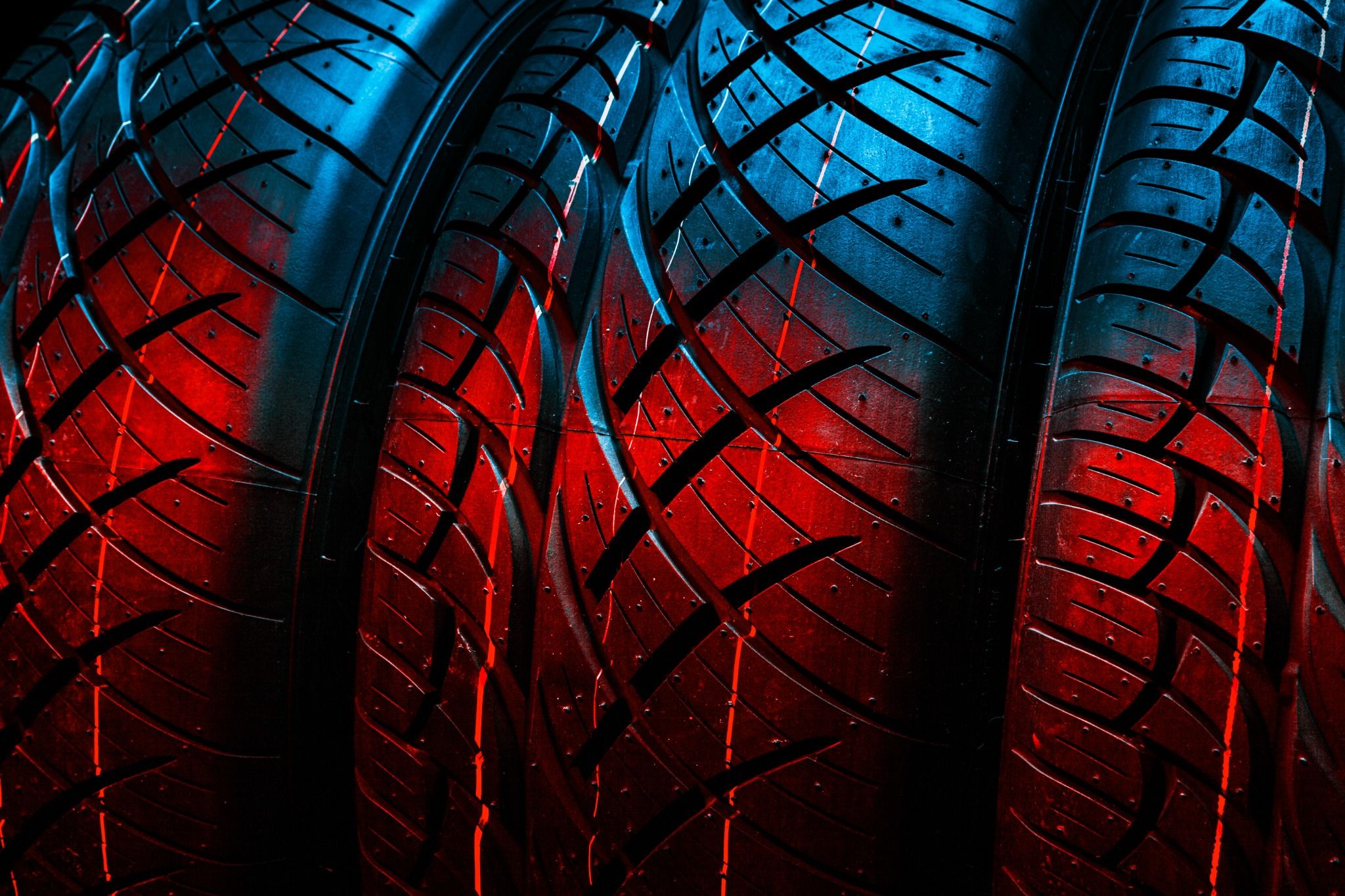 View of three tires lit up in red and blue