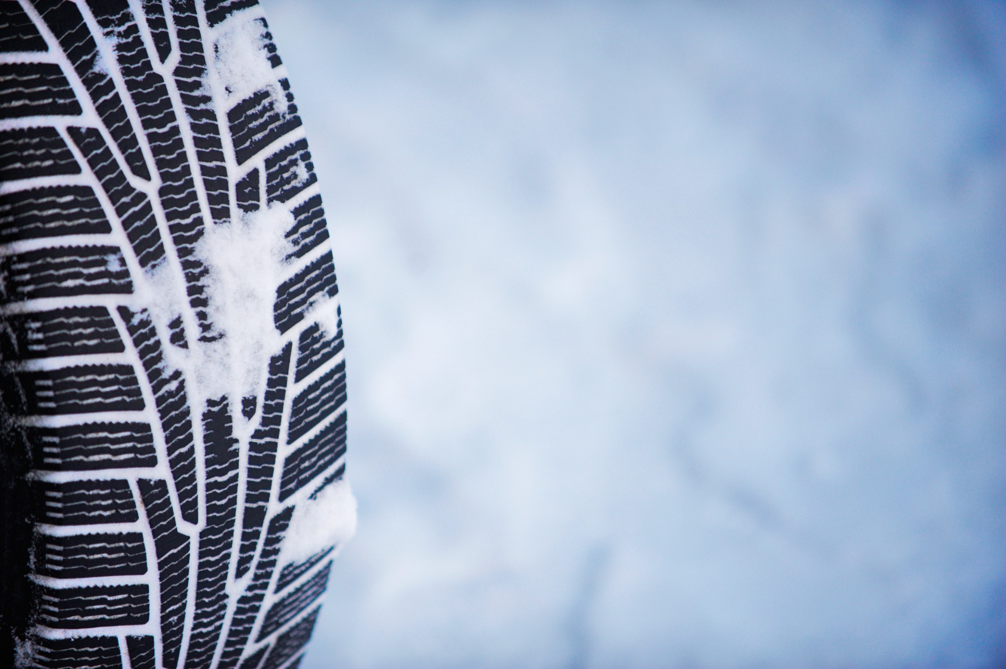 isolated view of snow-covered tire