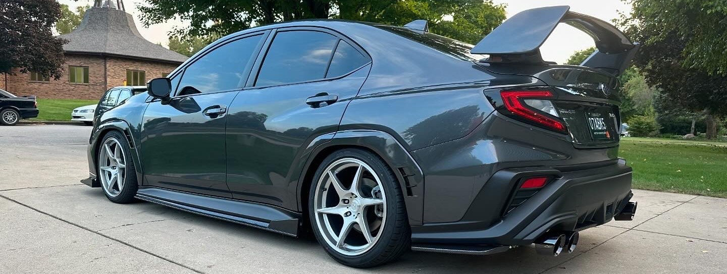 profile view of lowered car in driveway