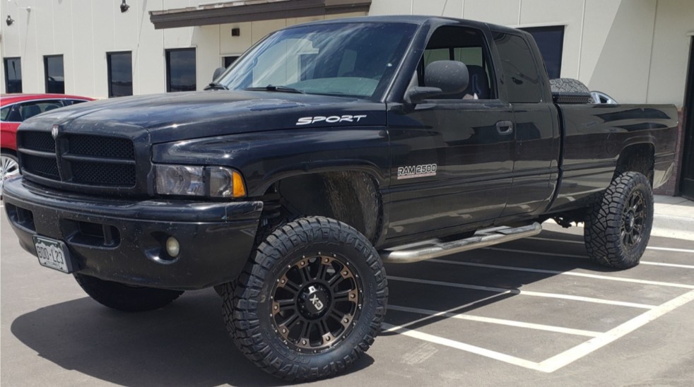 black dodge ram 2500 in parking lot
