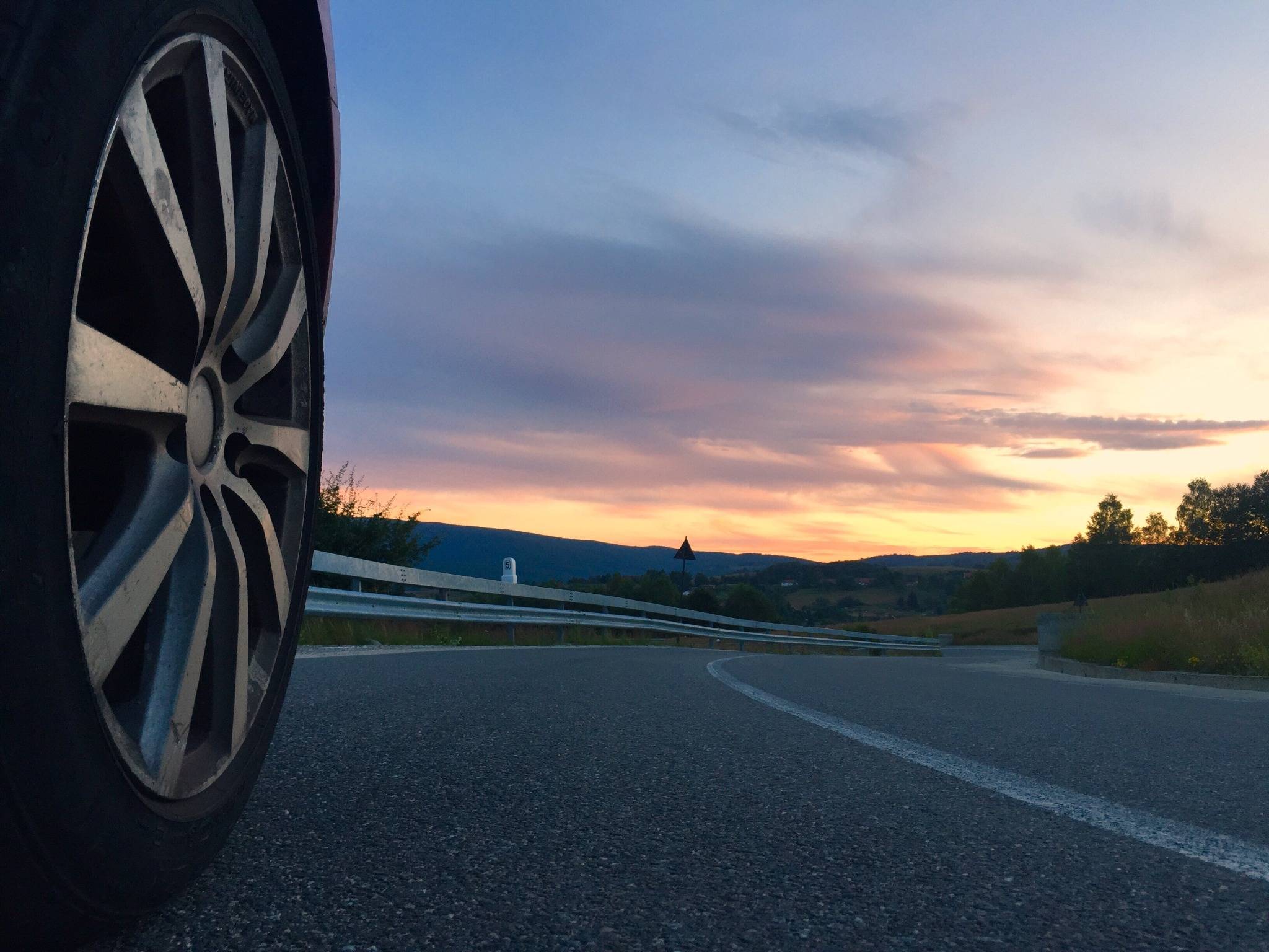 Tire on road at sunset