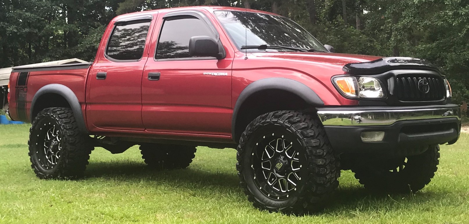 red toyota tacoma on field