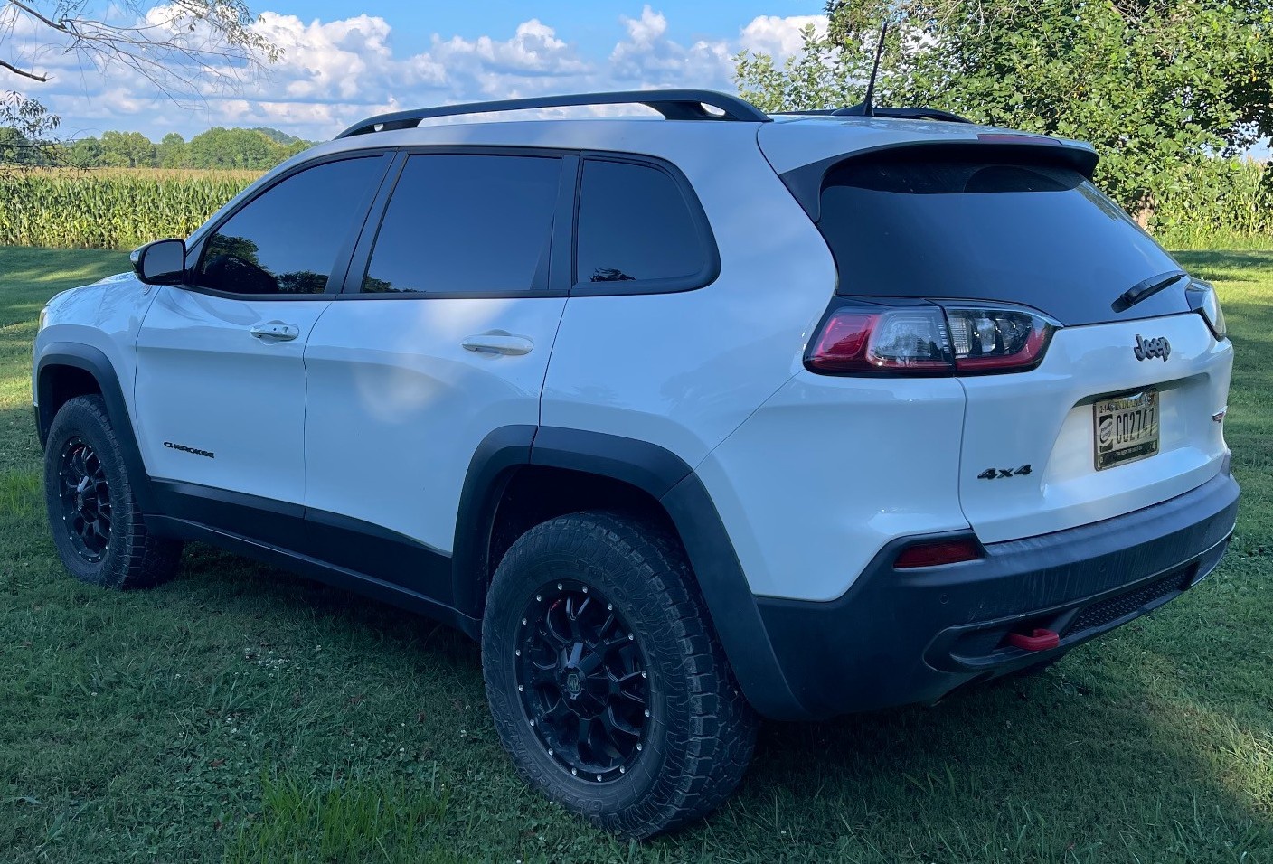 white jeep cherokee on grass