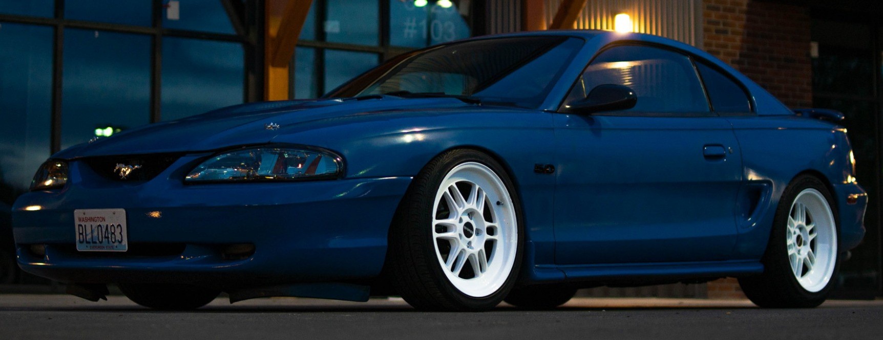 front view of blue fourth-gen mustang