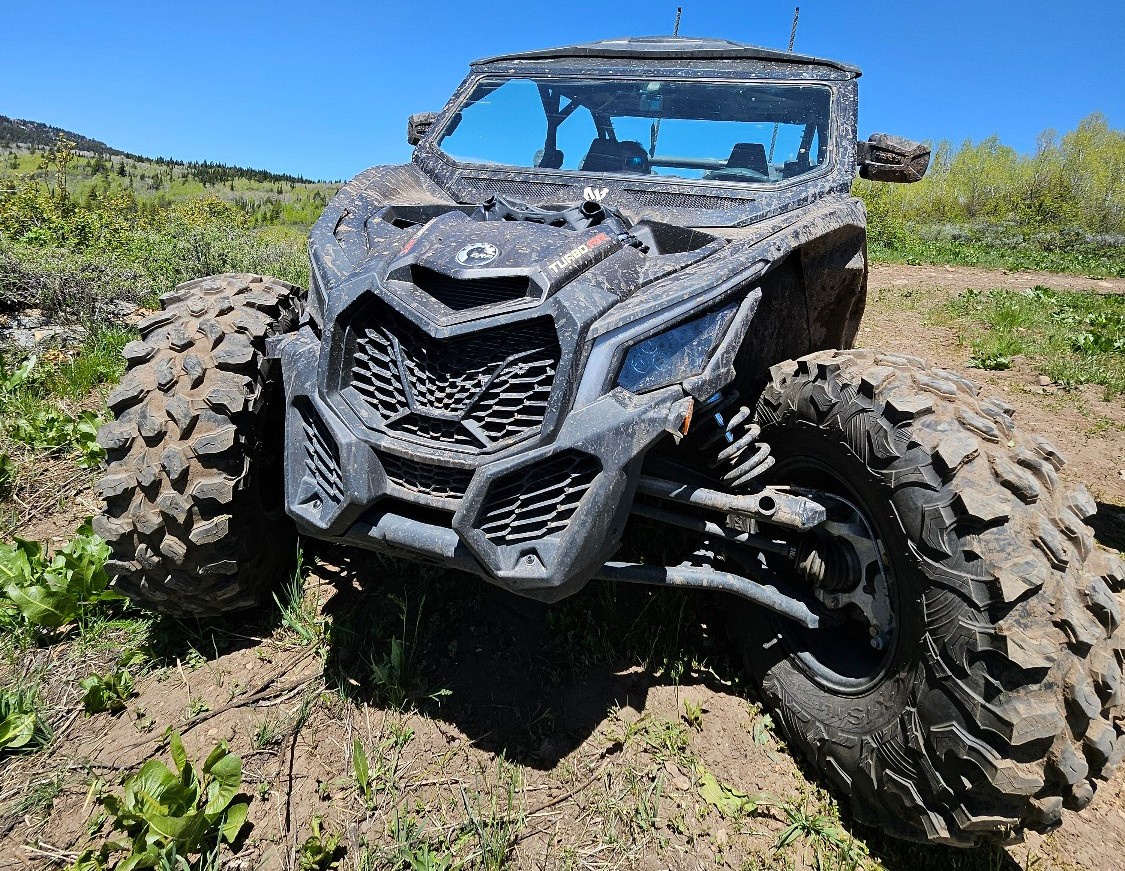 front view of black utv on trail