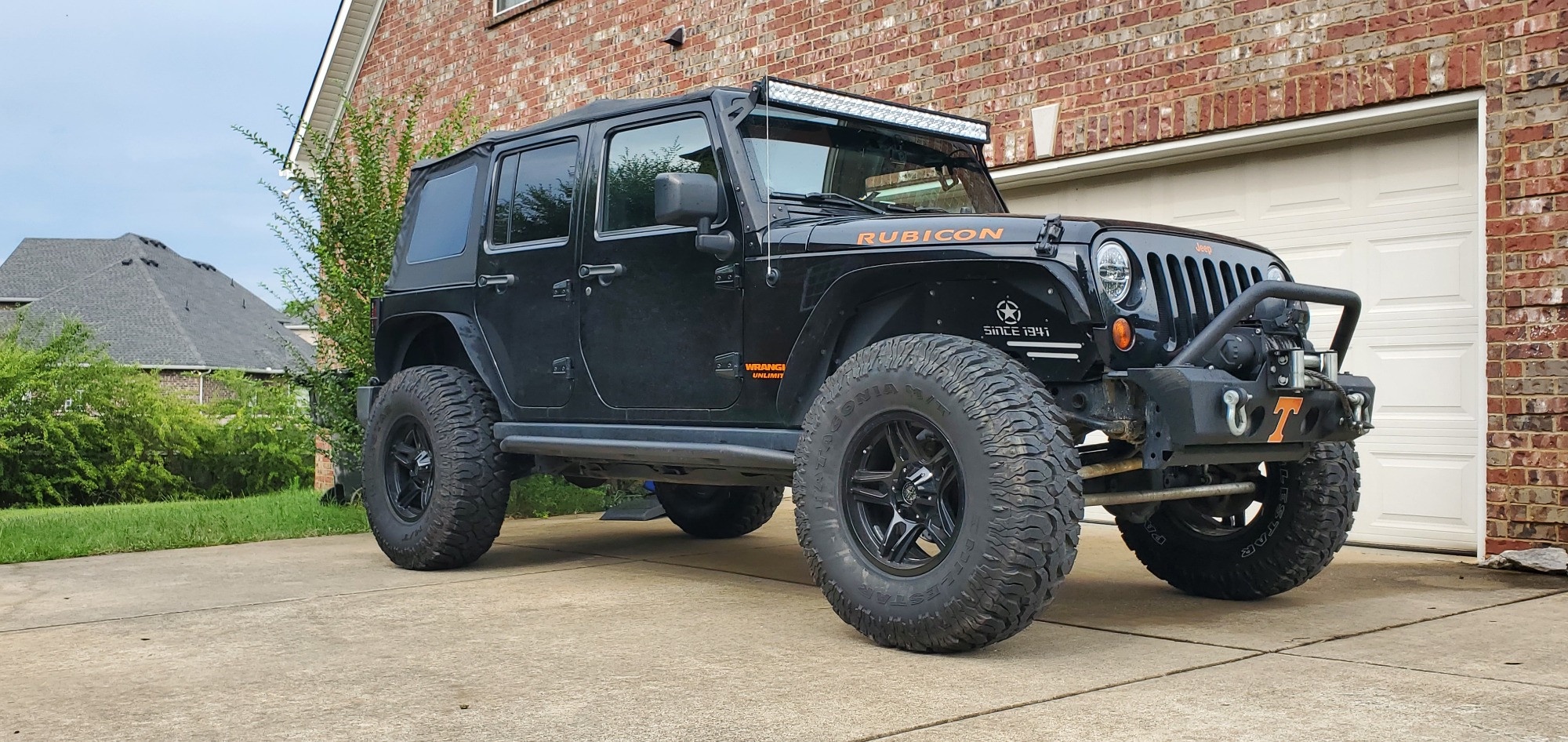 lifted jeep wrangler on driveway