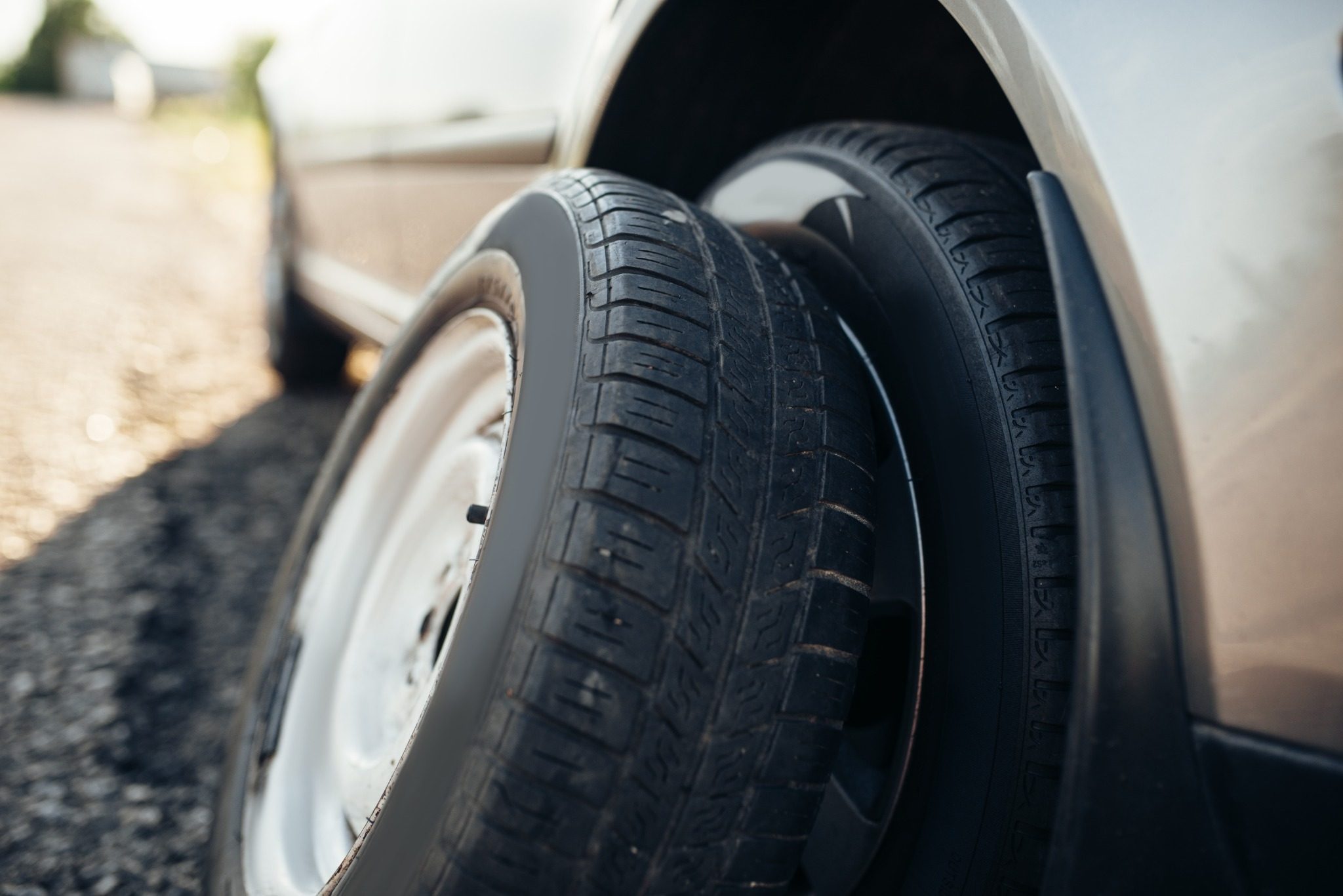Wheel & Tires leaning against car