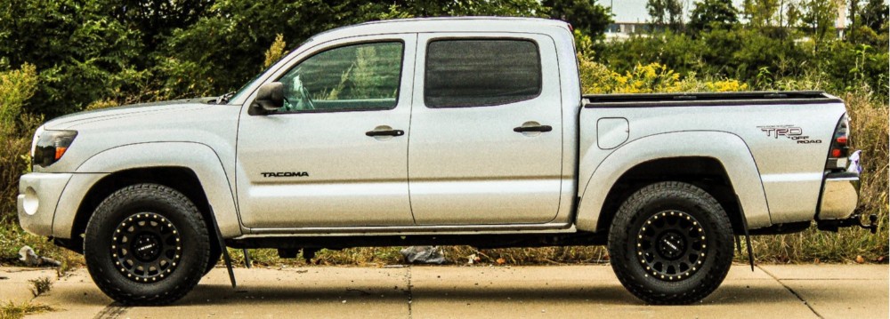 profile view of white toyota tacoma
