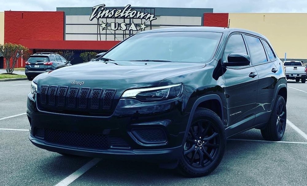 jeep cherokee latitude in movie theater parking lot