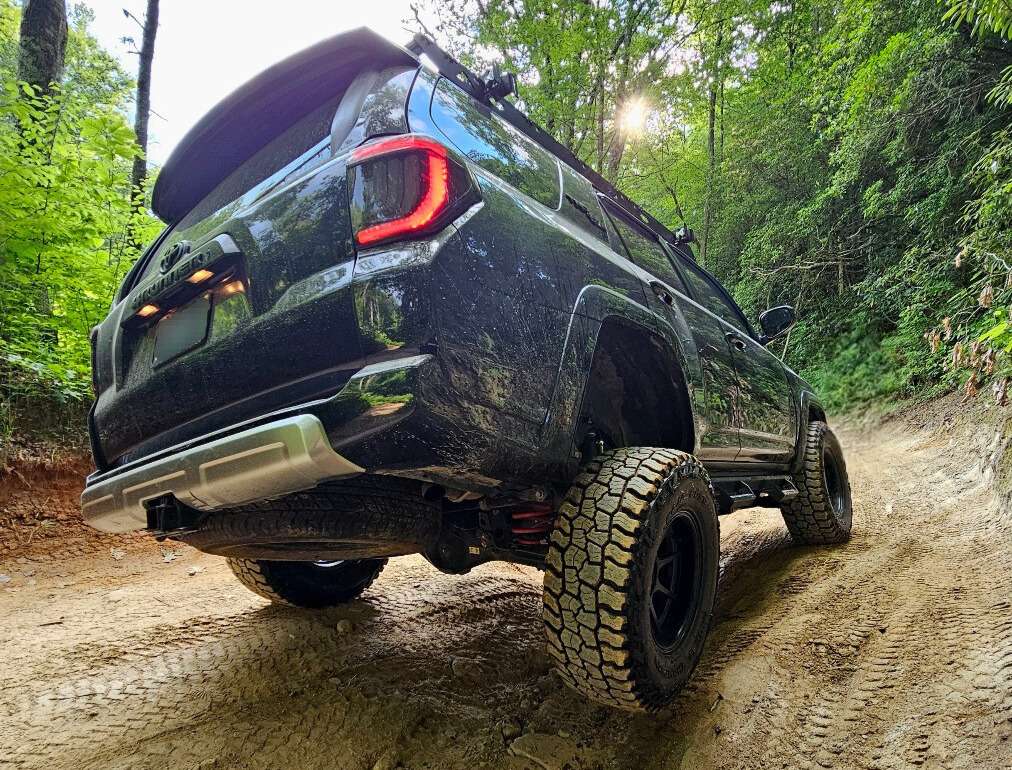 rear view of off-roader on trail