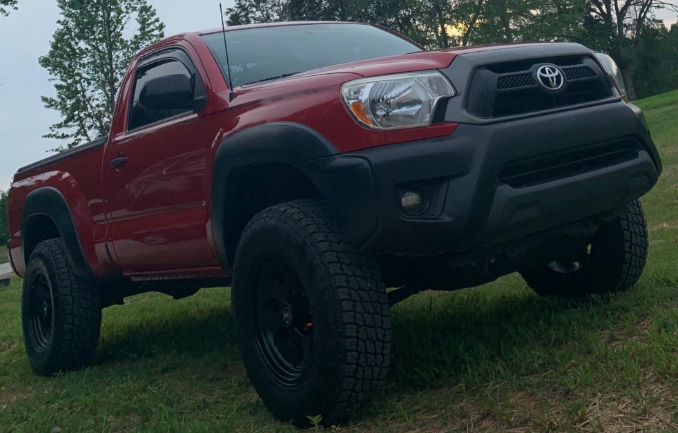 red toyota tacoma with stock suspension