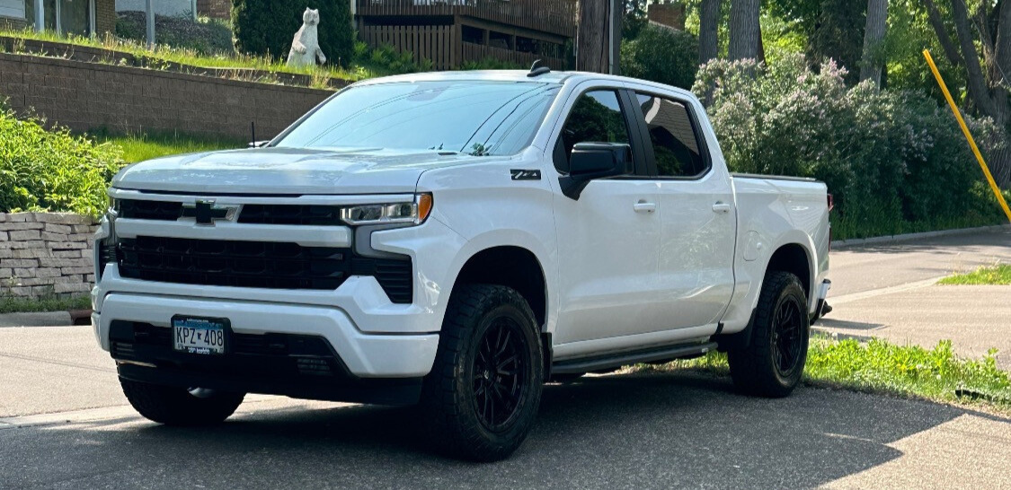 front view of white chevrolet truck