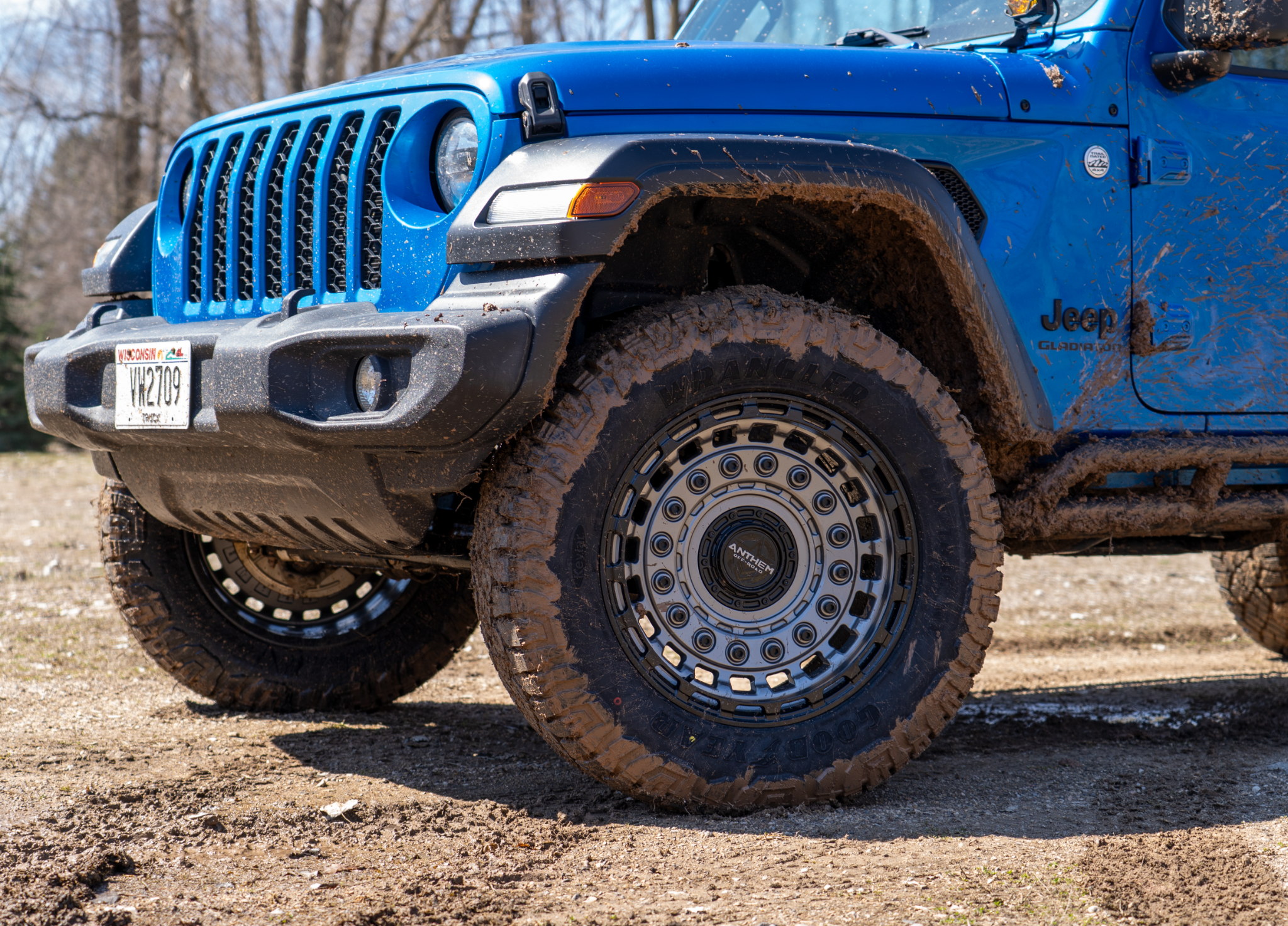 Anthem Off-Road Mercenary wheels on a Jeep Gladiator with muddy Goodyear Wrangler Duratrac tires