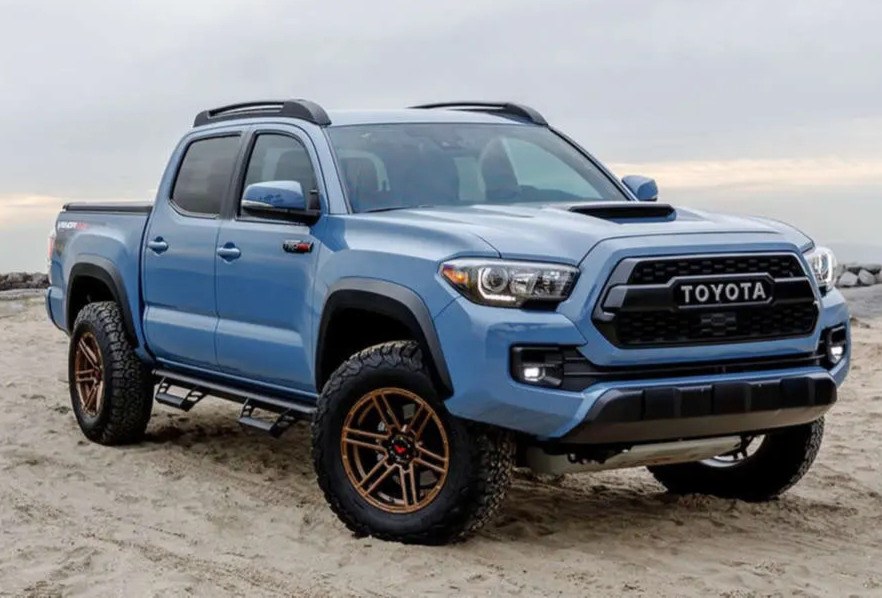 2018 Toyota Tacoma with BFGoodrich All-Terrain TA KO2 tires parked on a beach