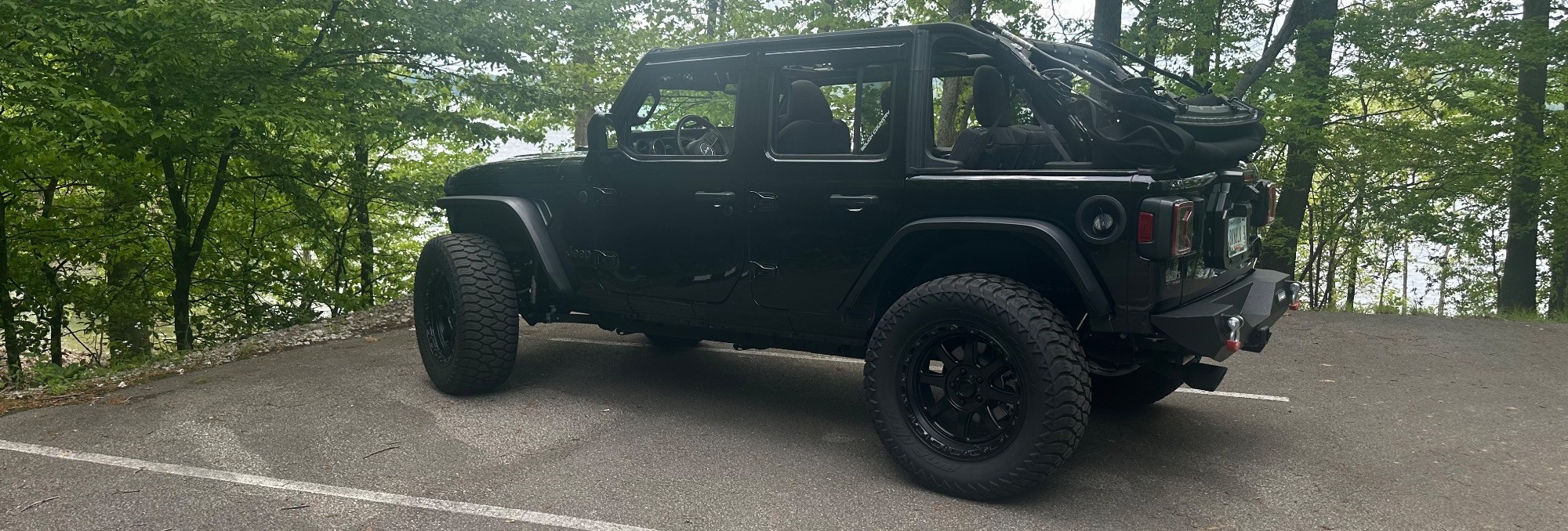 profile view of jeep in parking lot