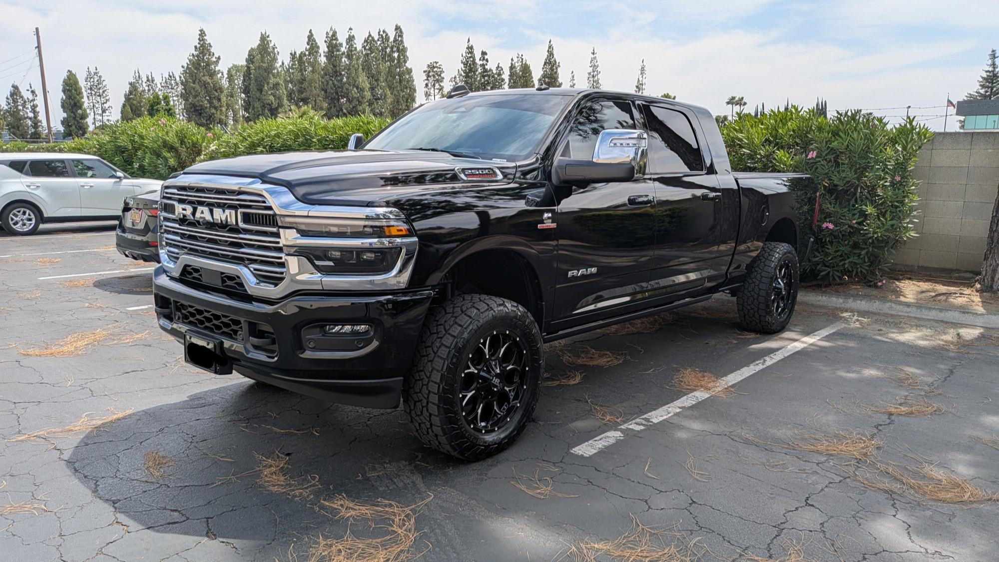 black ram 2500 with aftermarket wheels and tires