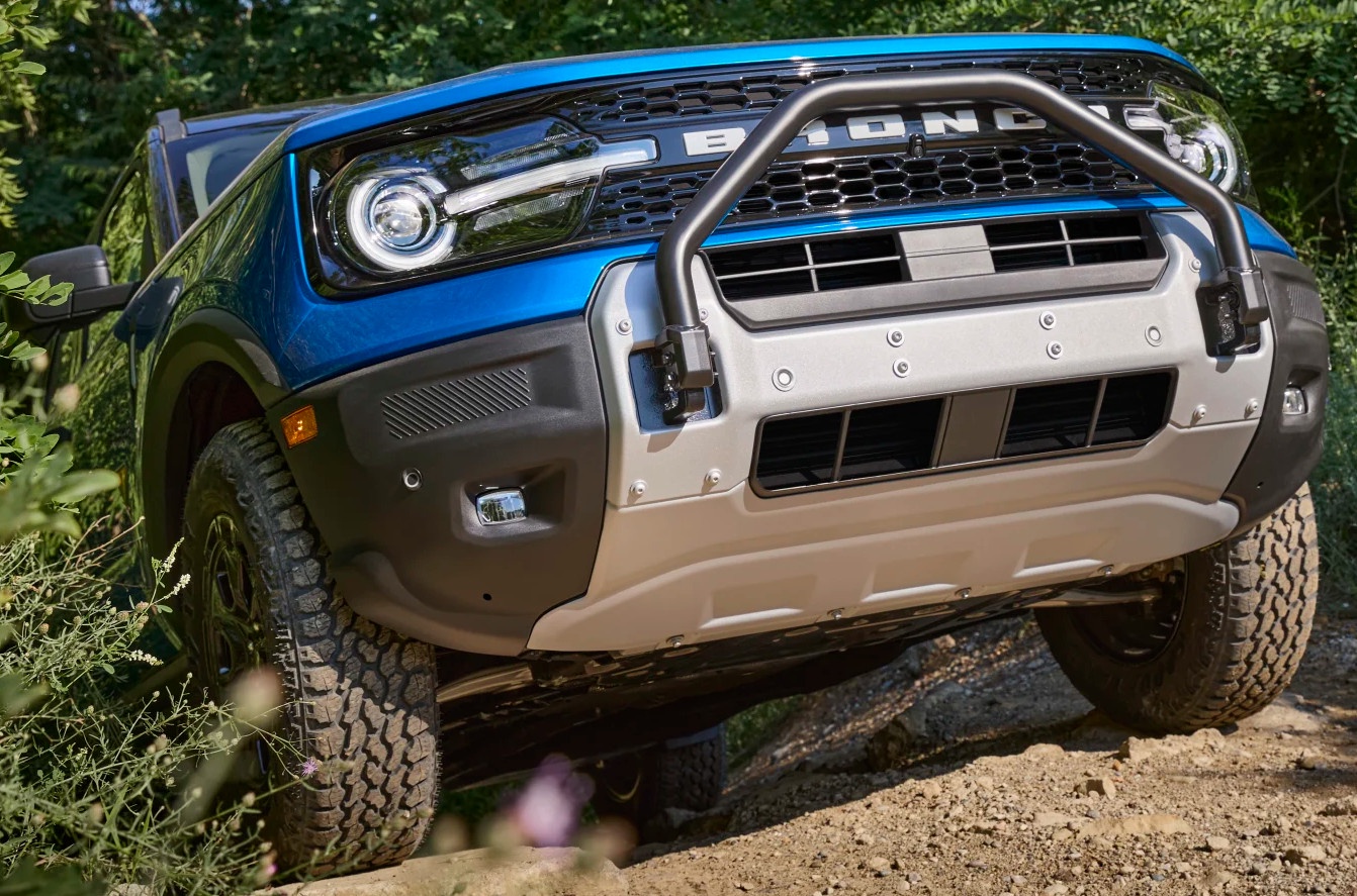 front view of blue ford bronco sport driving up hill