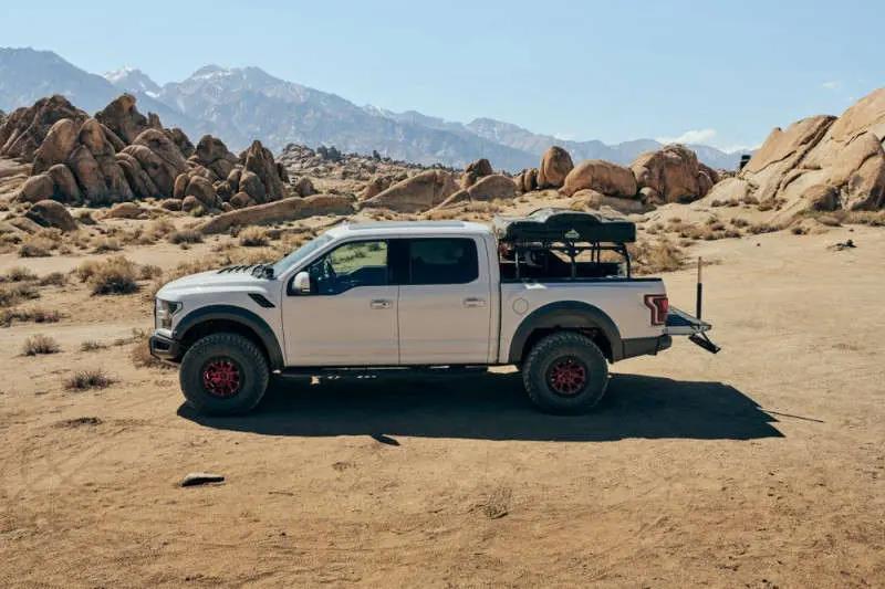 profile view of white truck in desert