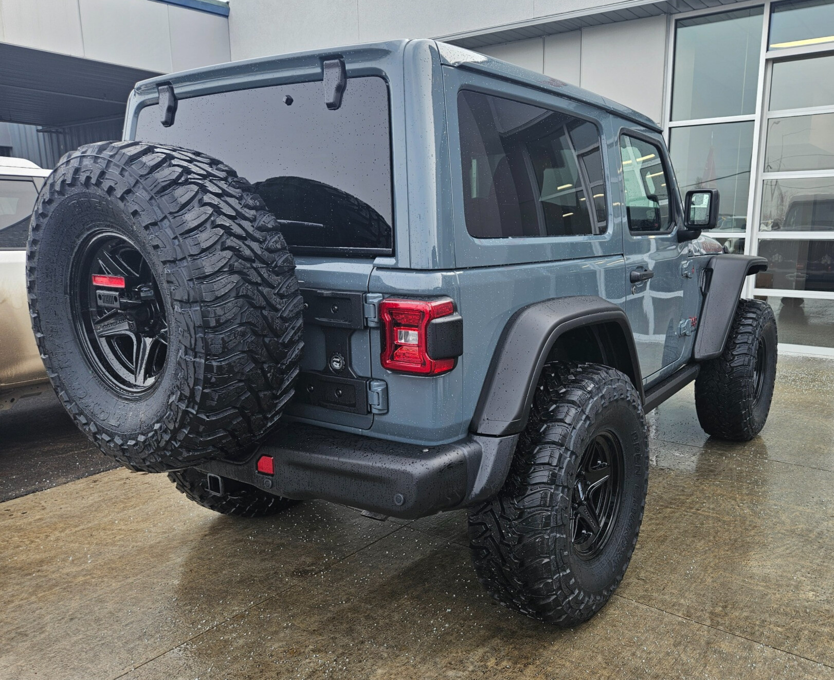 rear shot of blue off-roader