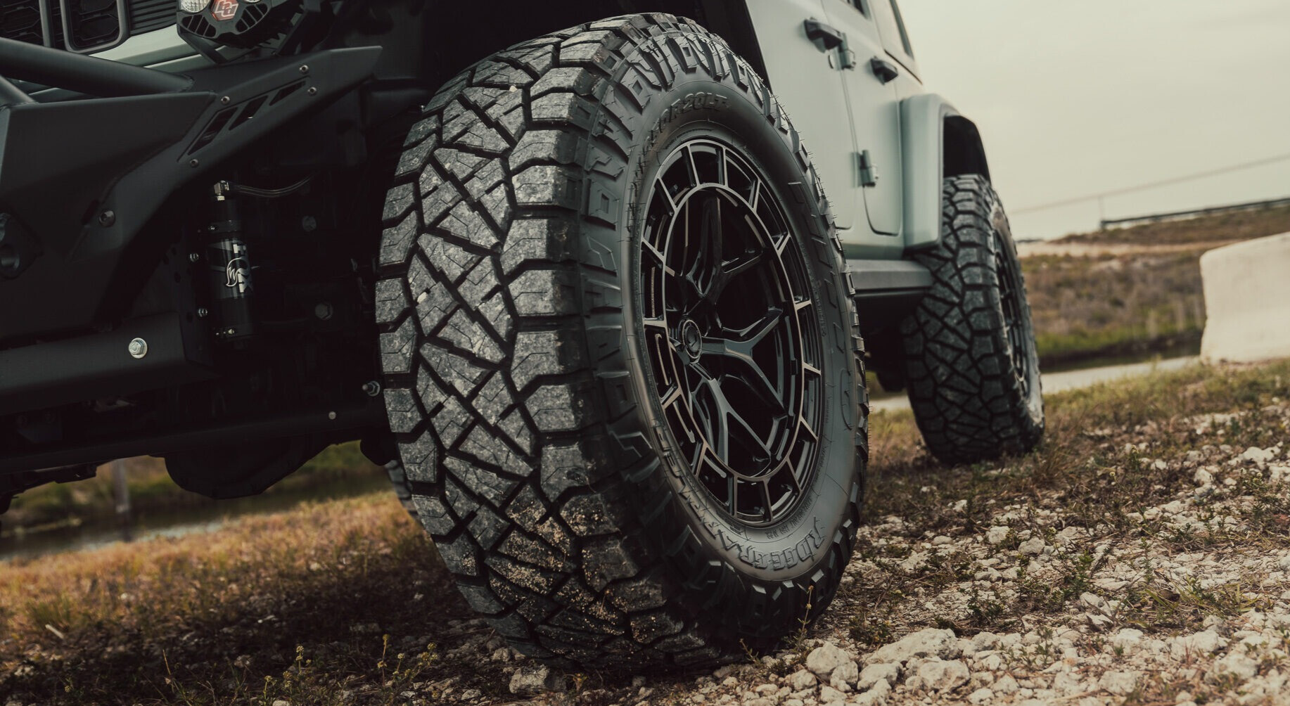 black tires on white jeep