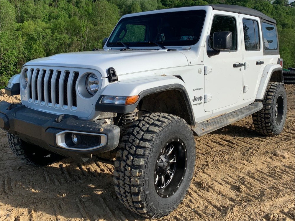 white jeep wrangler on trail